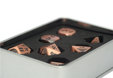 Gyld Metal Damage Dice - Bludgeoning bronze copper metal dice in a tin