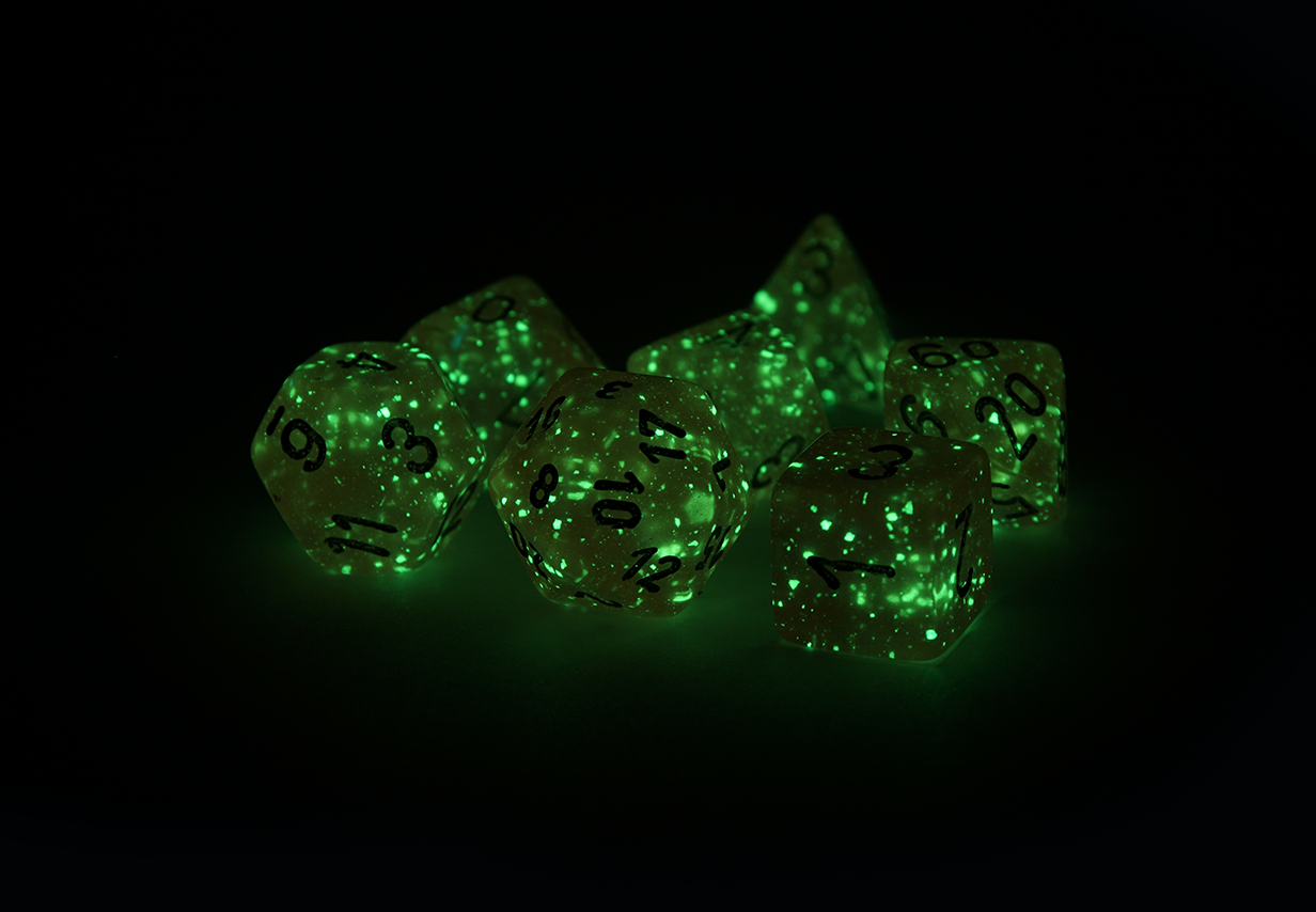 Chessex Borealis | Pink dice with silver ink that glow in the dark glowing in the dark